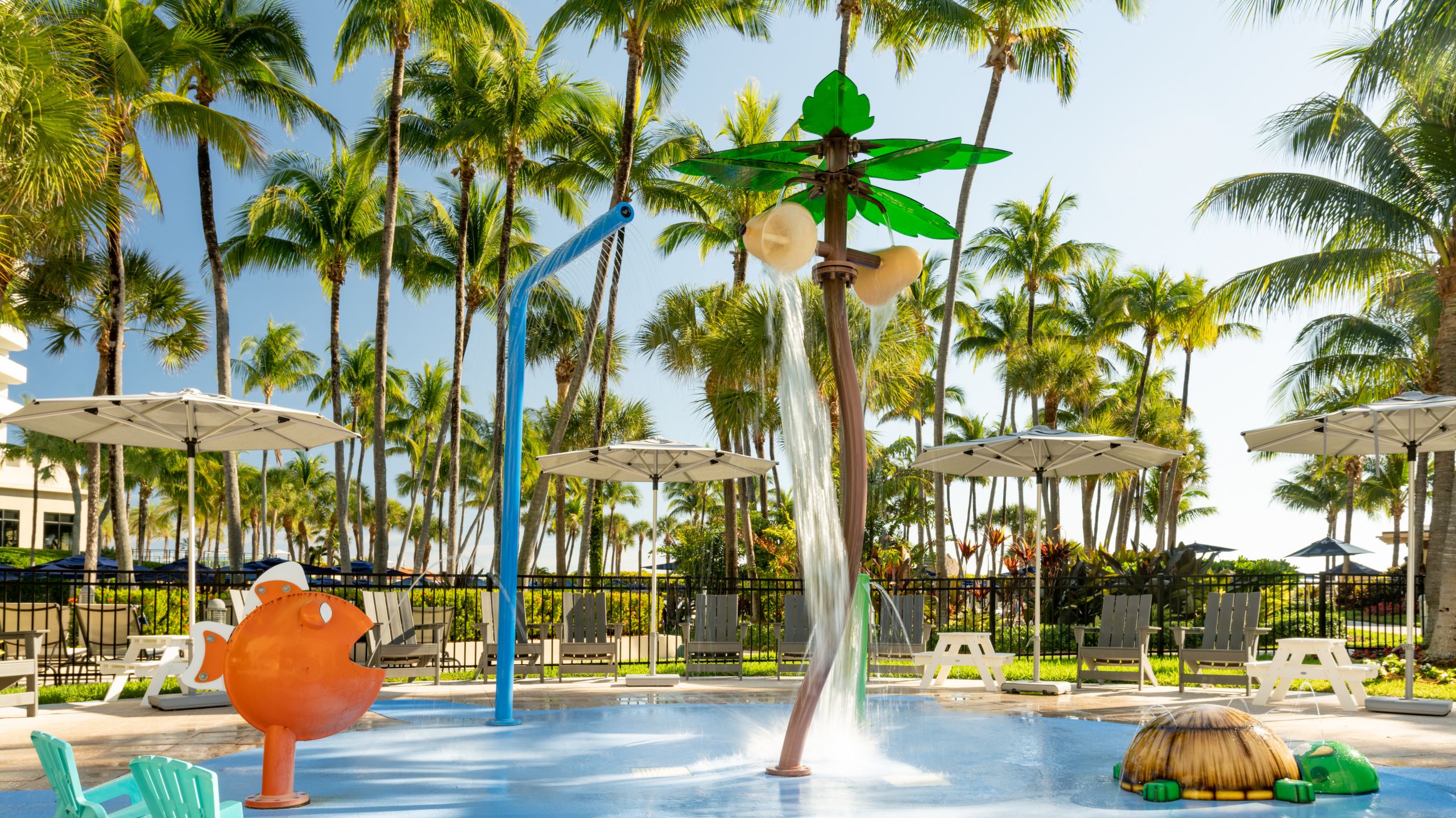 An outdoor swimming pool and resting area at the Fort Lauderdale Marriott Harbor Beach Resort & Spa