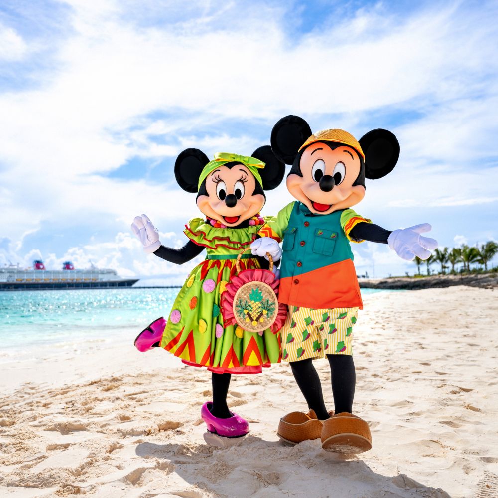 Minnie Mouse and Mickey Mouse posing with their Bahamian outfits in Disney Lookout Cay at Lighthouse Point