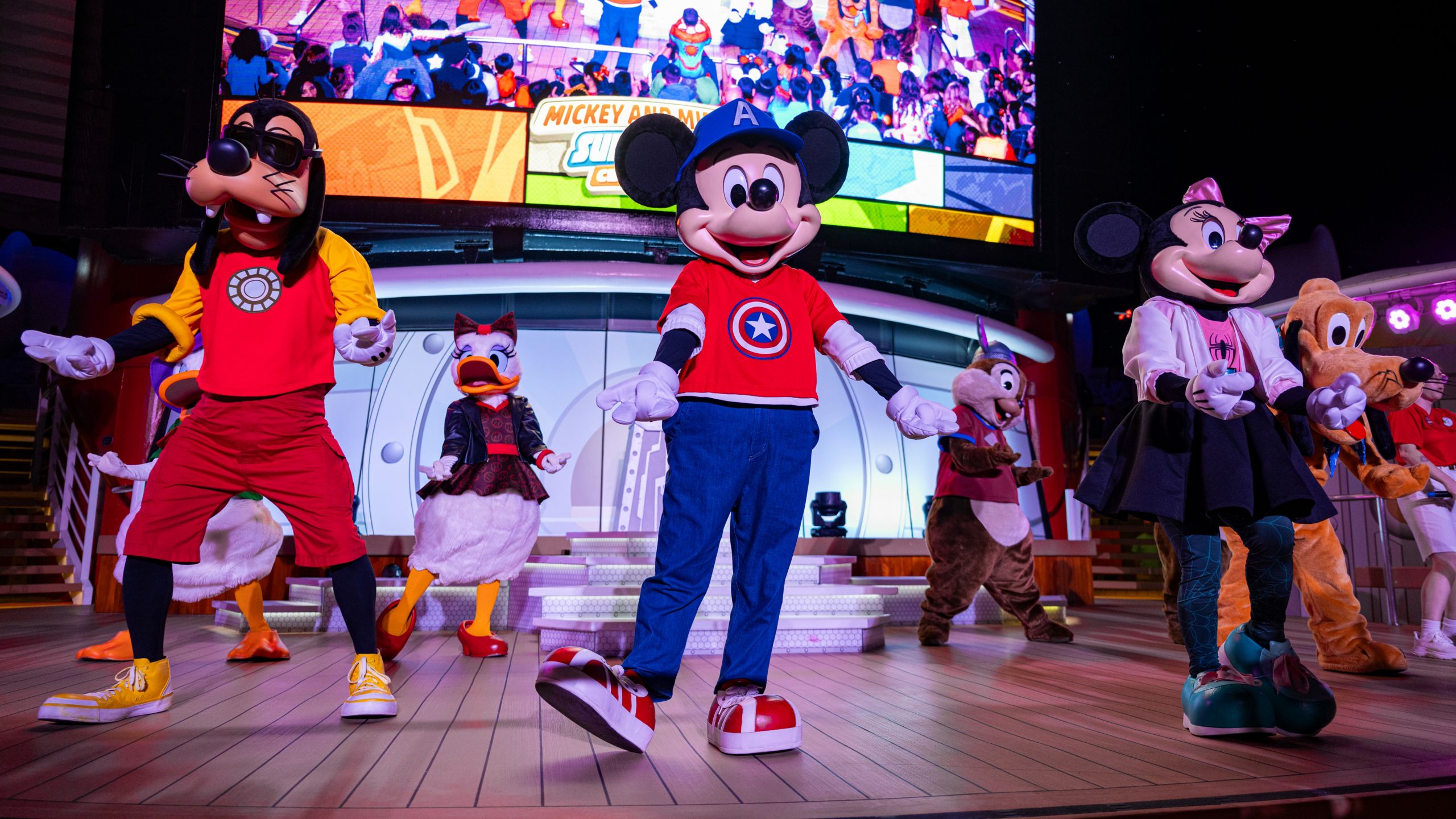 Mickey Mouse, Minnie Mouse and friends dancing on stage during Mickey and Minnie's Super Hero Celebration