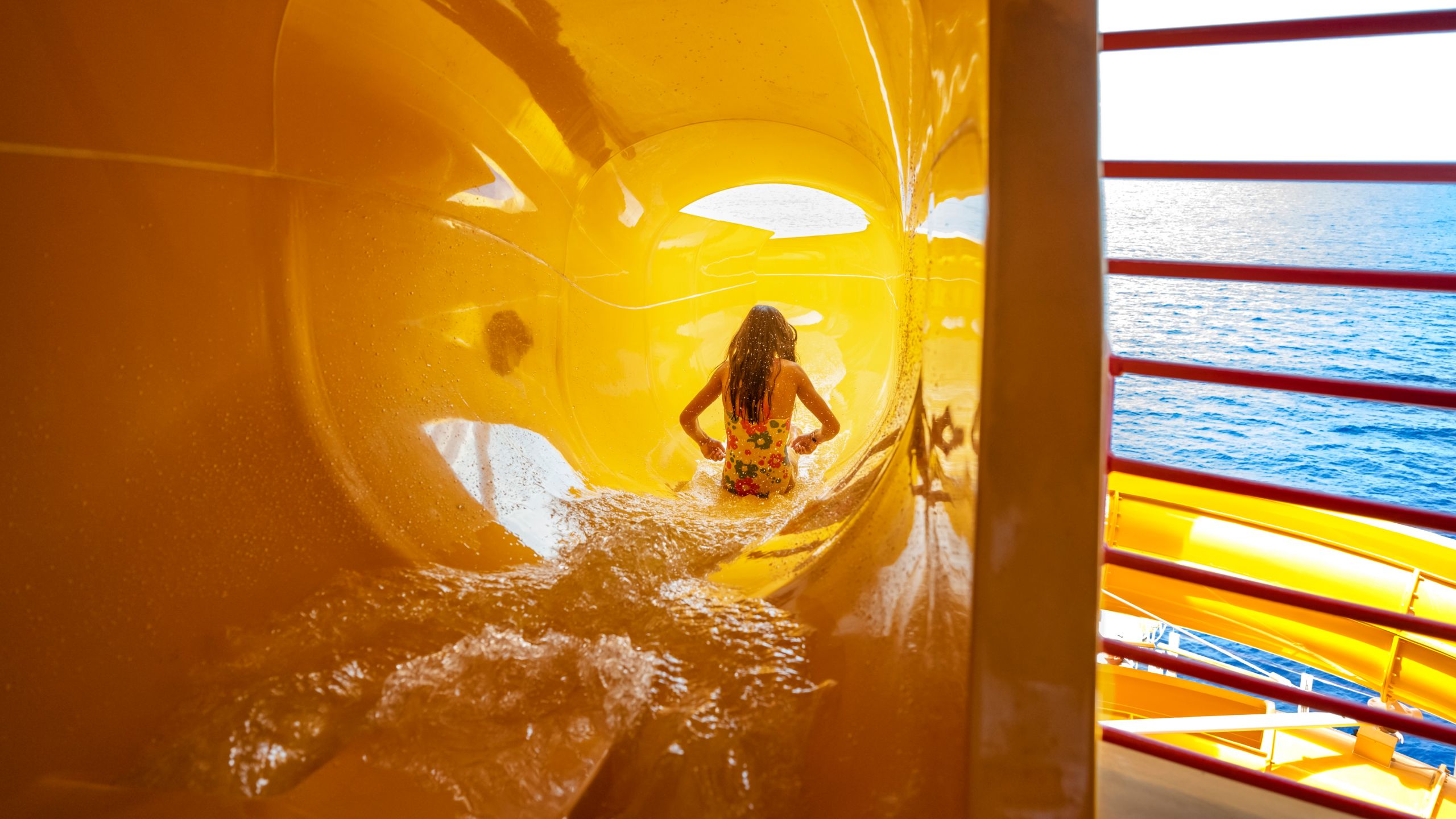 A girl sliding down a waterslide