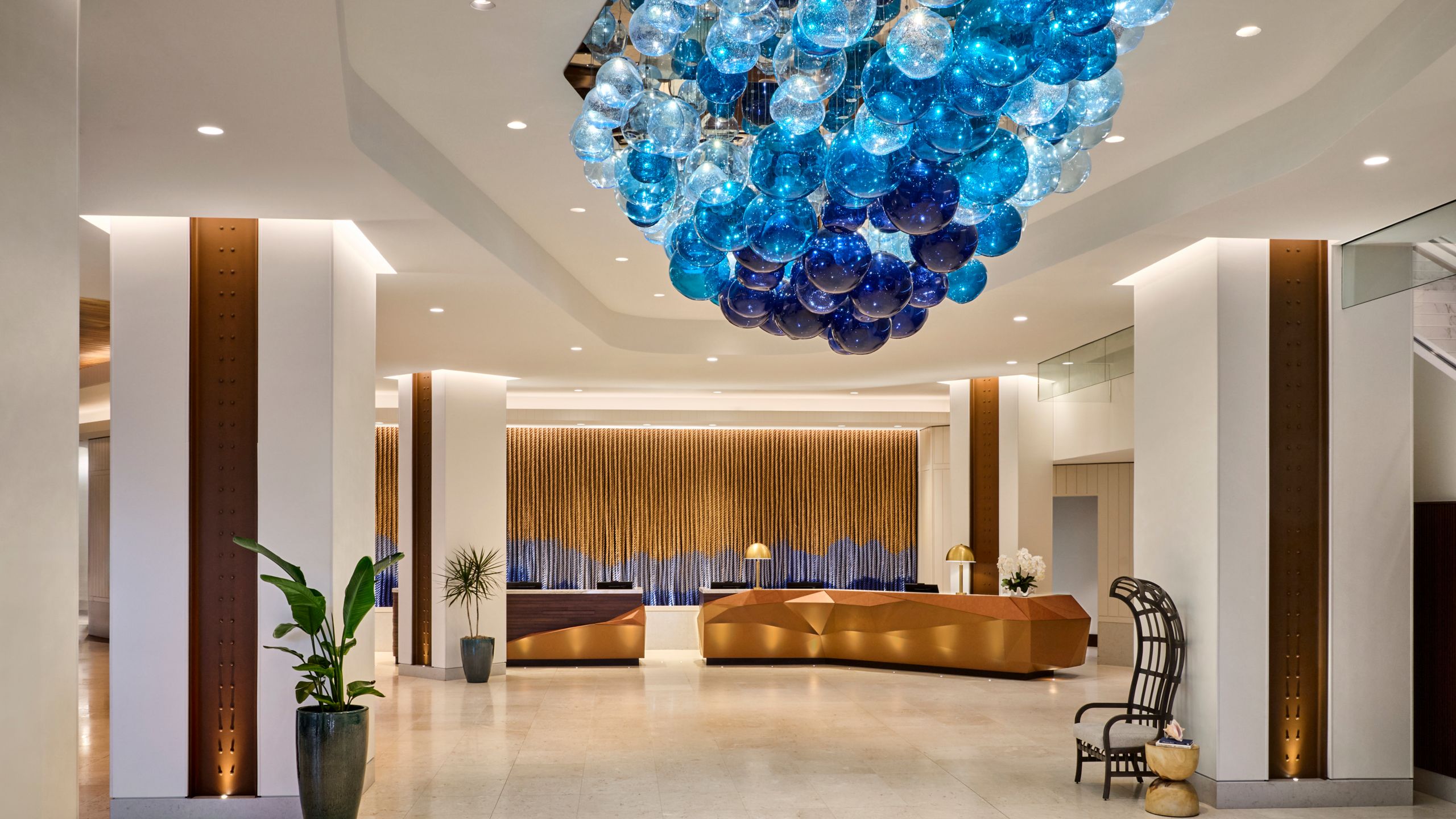 A spacious lobby with a cluster of festive balloons decorating a part of the ceiling at Omni Fort Lauderdale Hotel in Florida