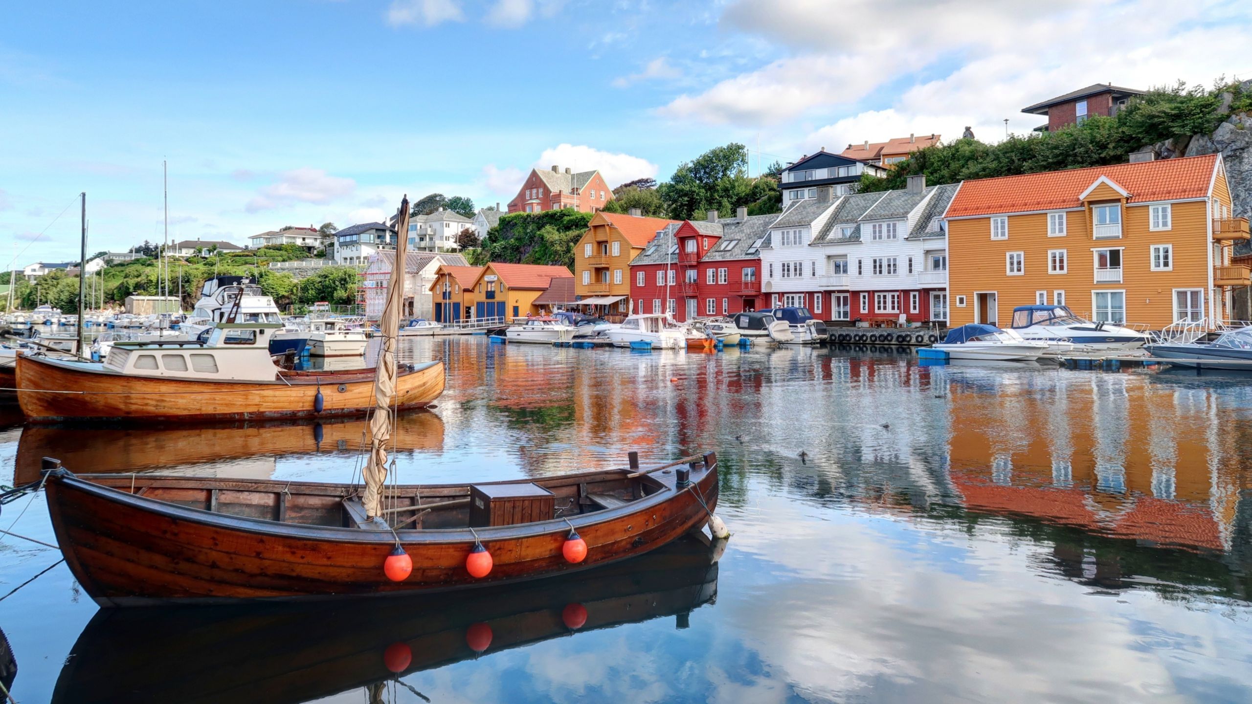 A harbor with boats and houses in Haugesund, Norway