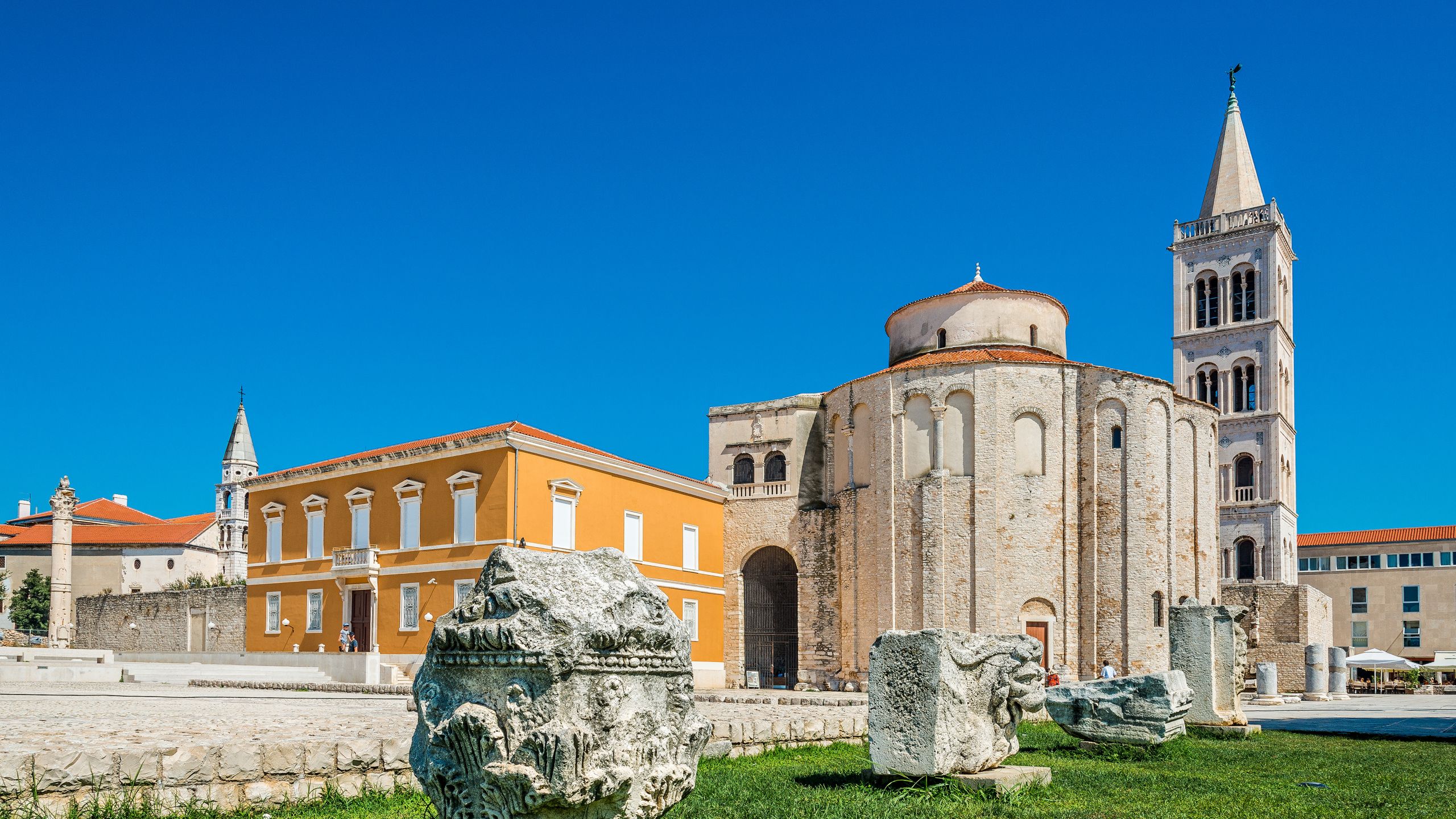 Roman stones sitting near the Archaeological Museum of Zadar, the Church of Saint Donatus and the Cathedral of Saint Anastasia