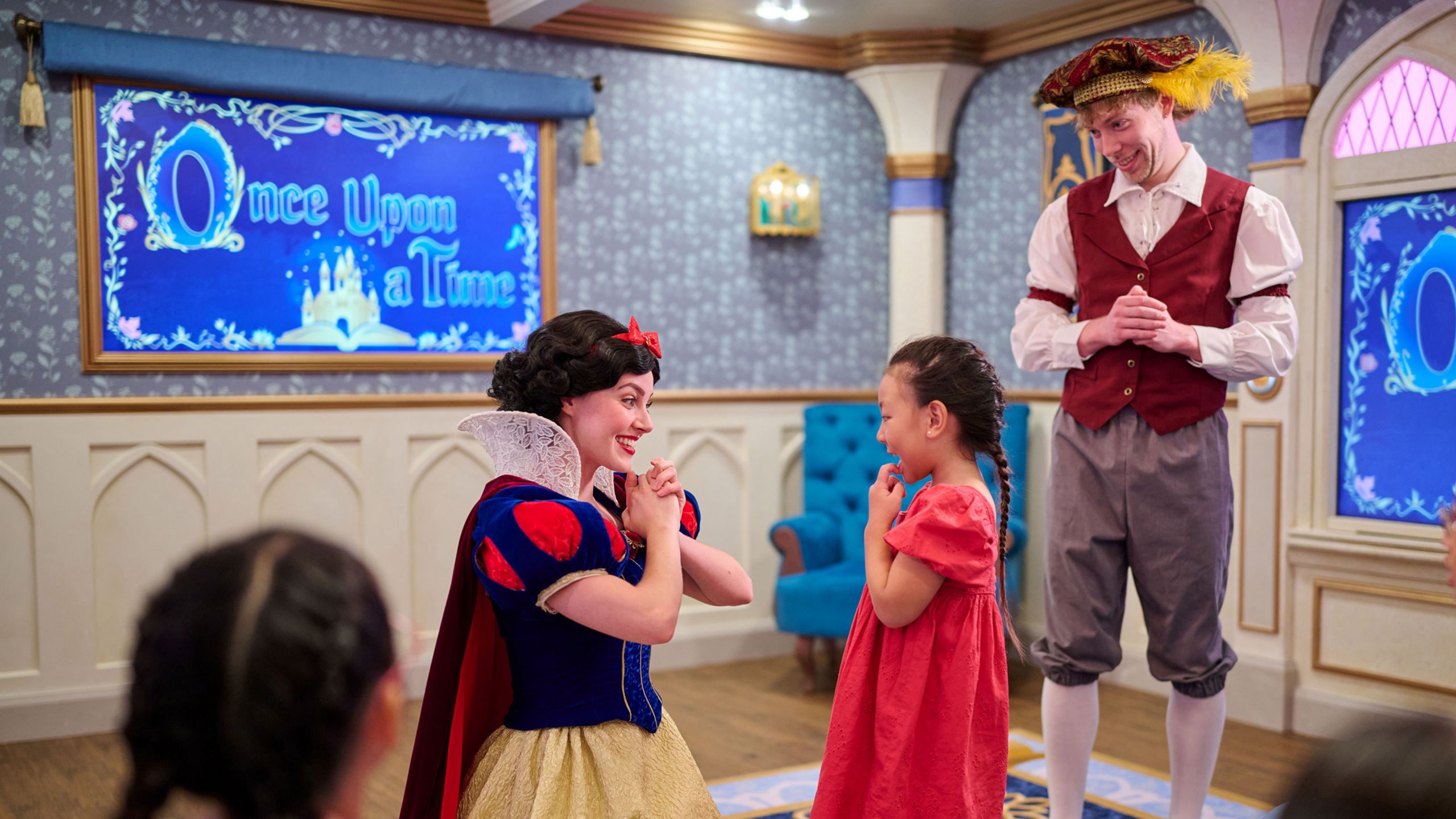 Snow White greeting a young girl while on board the Disney Adventure cruise ship
