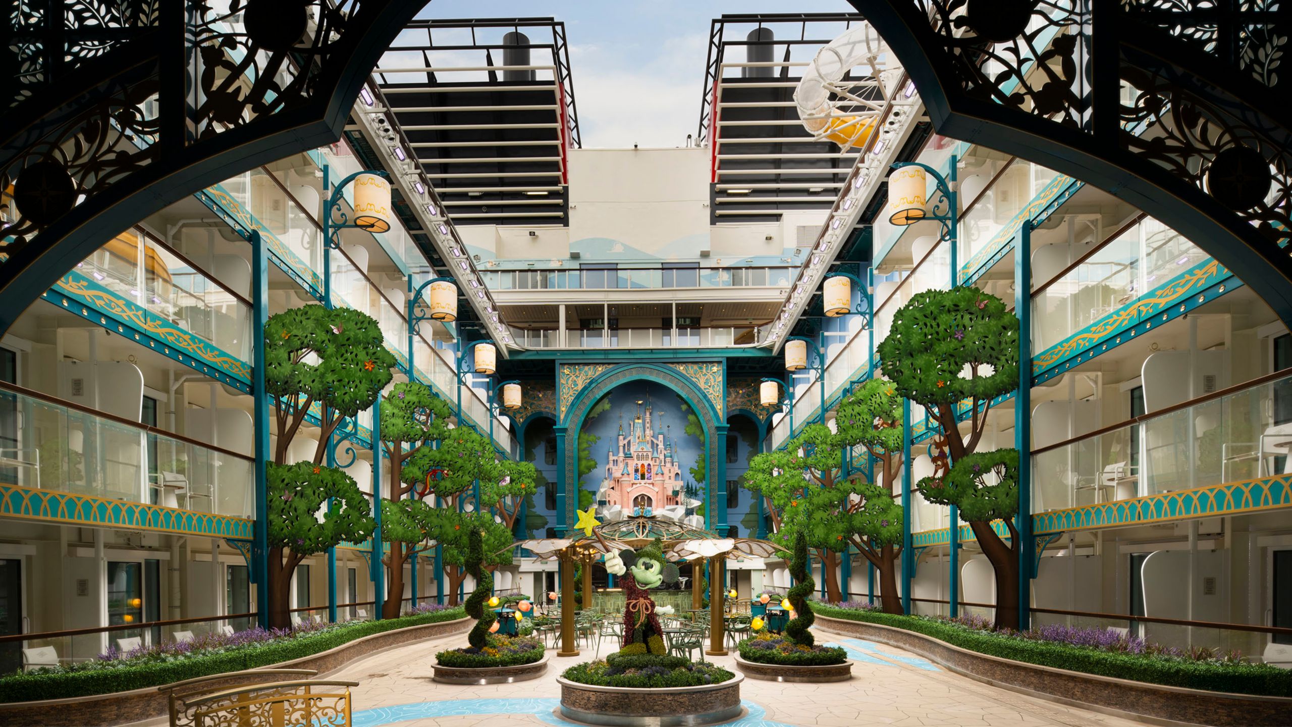 The Disney Imagination Garden on the Disney Adventure cruise ship, with Sorcerer Mickey in a patio area