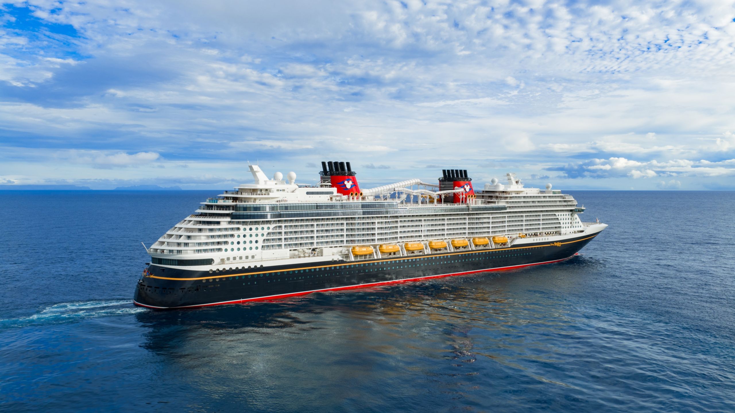 The Disney Destiny cruise ship sailing on the open ocean