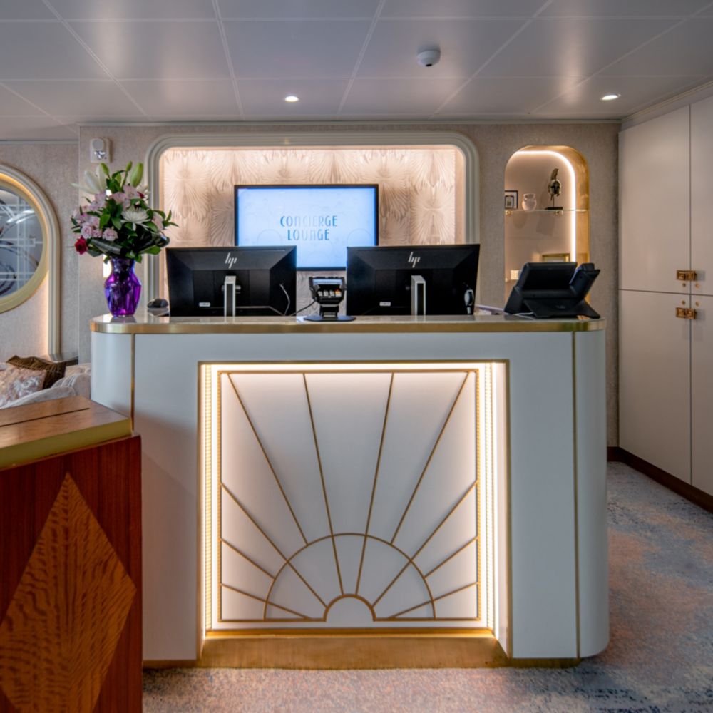 The front desk of the Disney Dream Concierge Lounge