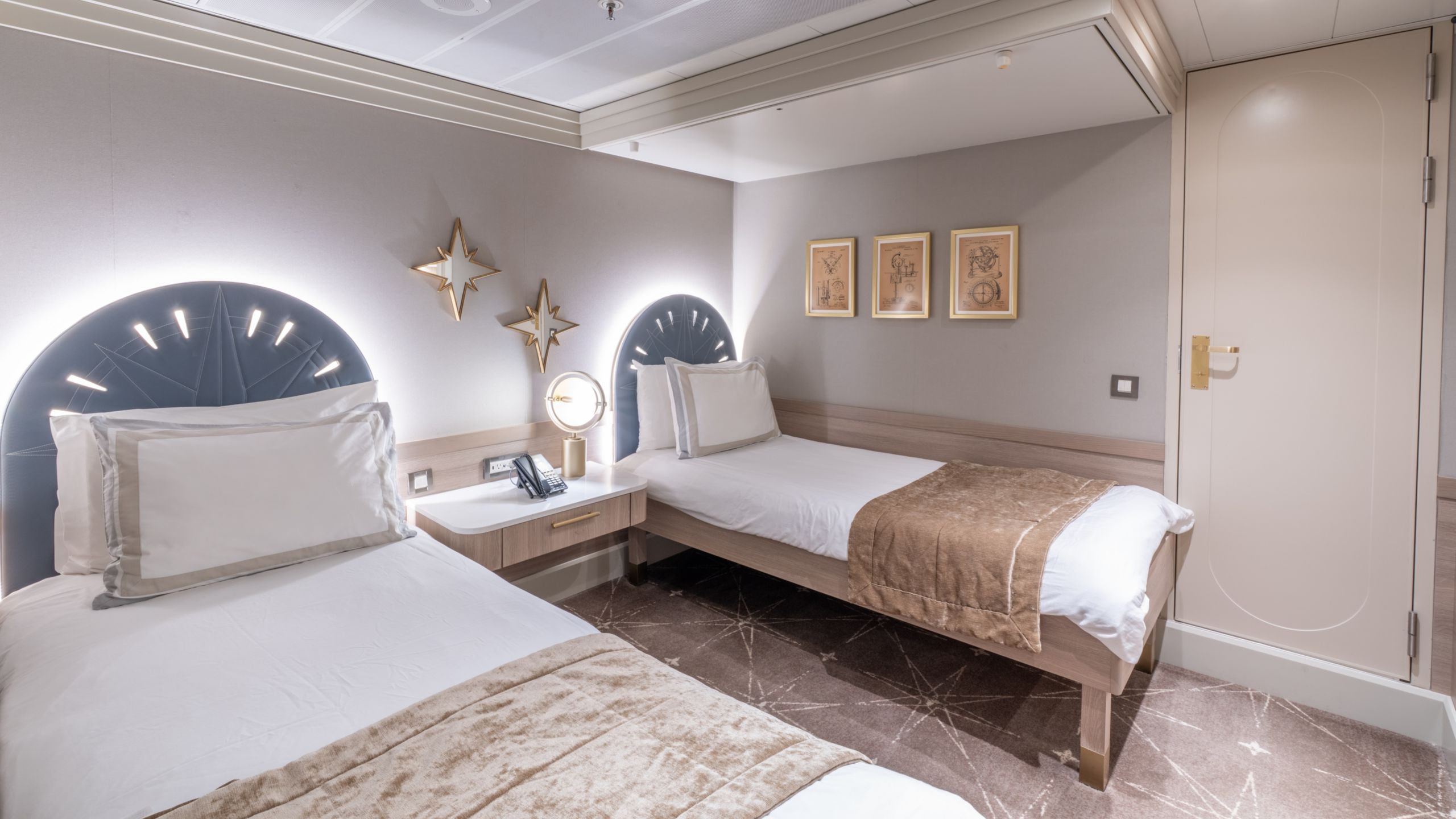 A bedroom with 2 beds, a bunk bed and a nightstand in a Disney Magic Concierge 2 Bedroom Suite with Verandah