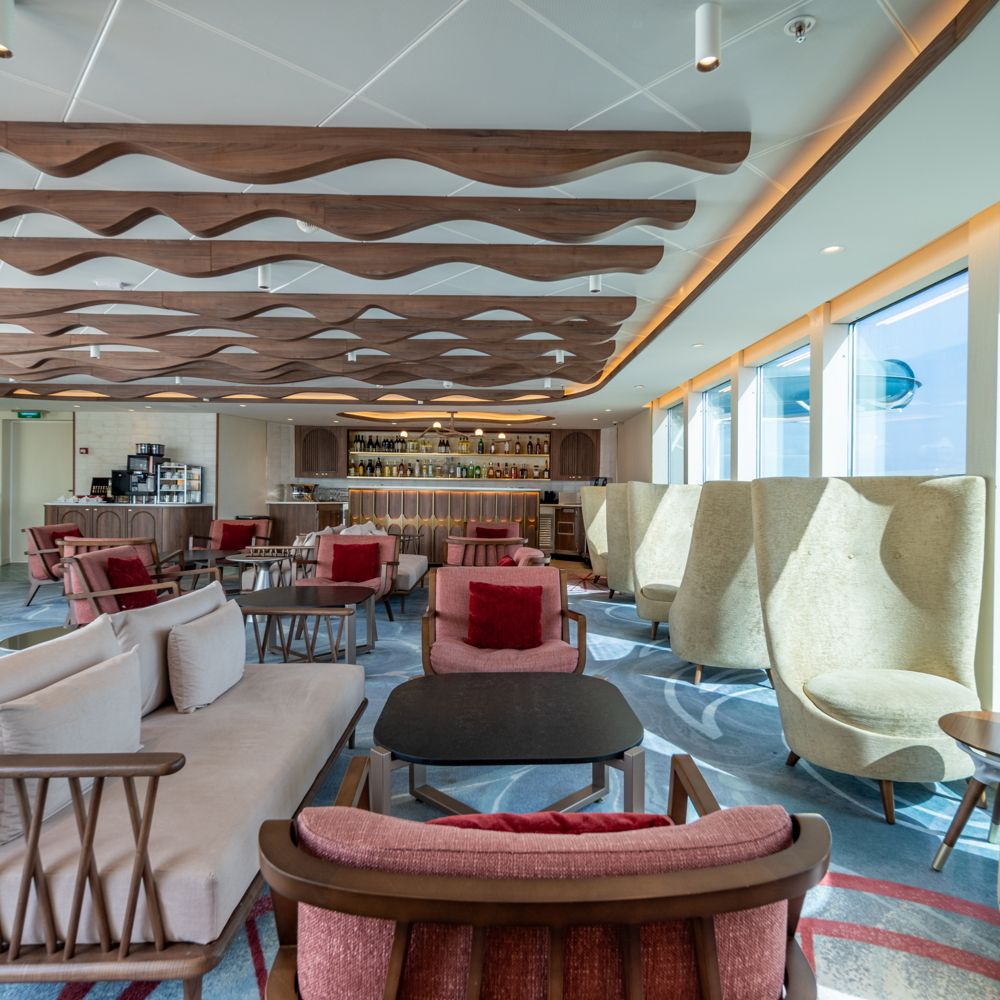 Sofas, chairs and tables in the Disney Magic Concierge Lounge