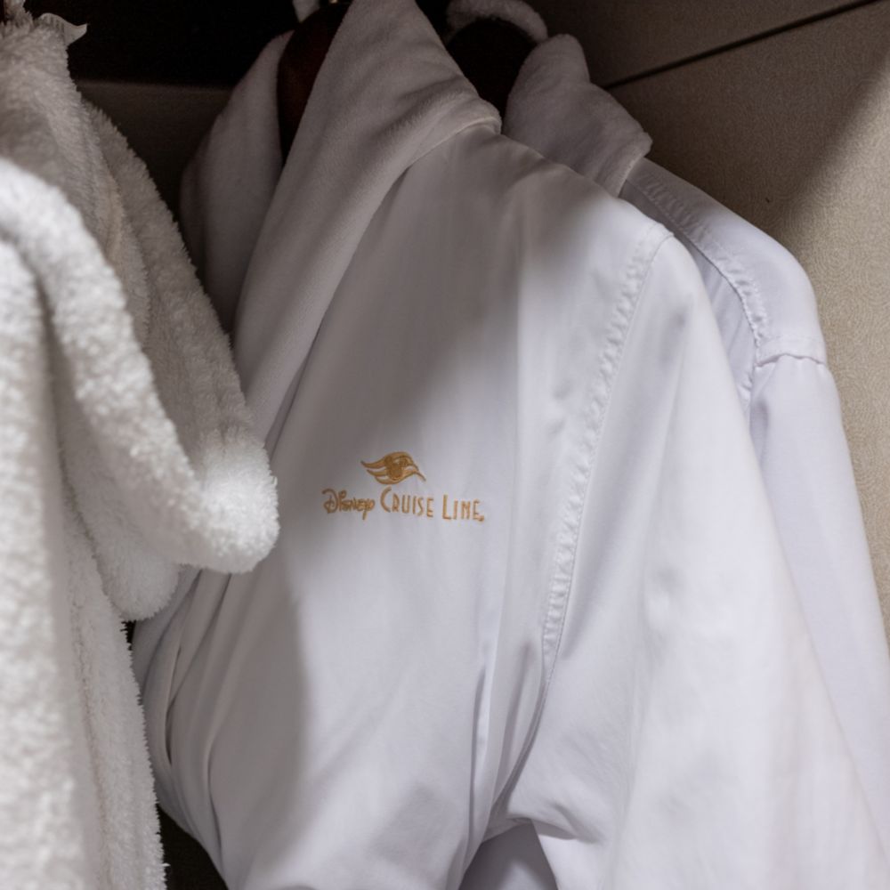 Disney Cruise Line bathrobes hanging in a closet