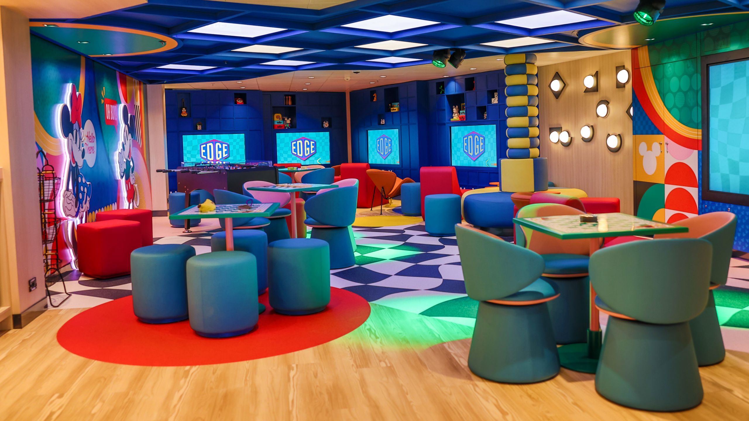 Tables, chairs, games and televisions at Edge, located on the Disney Magic and Disney Wonder cruise ships