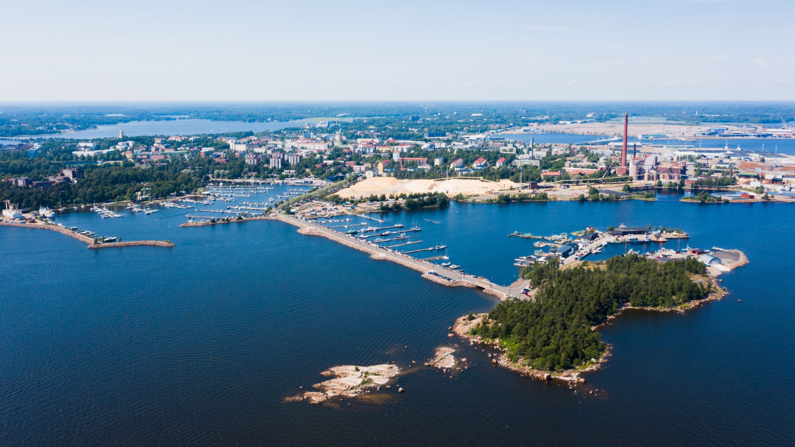 The 2 islands of Kotka, Finland with patches of woodlands and city buildings 