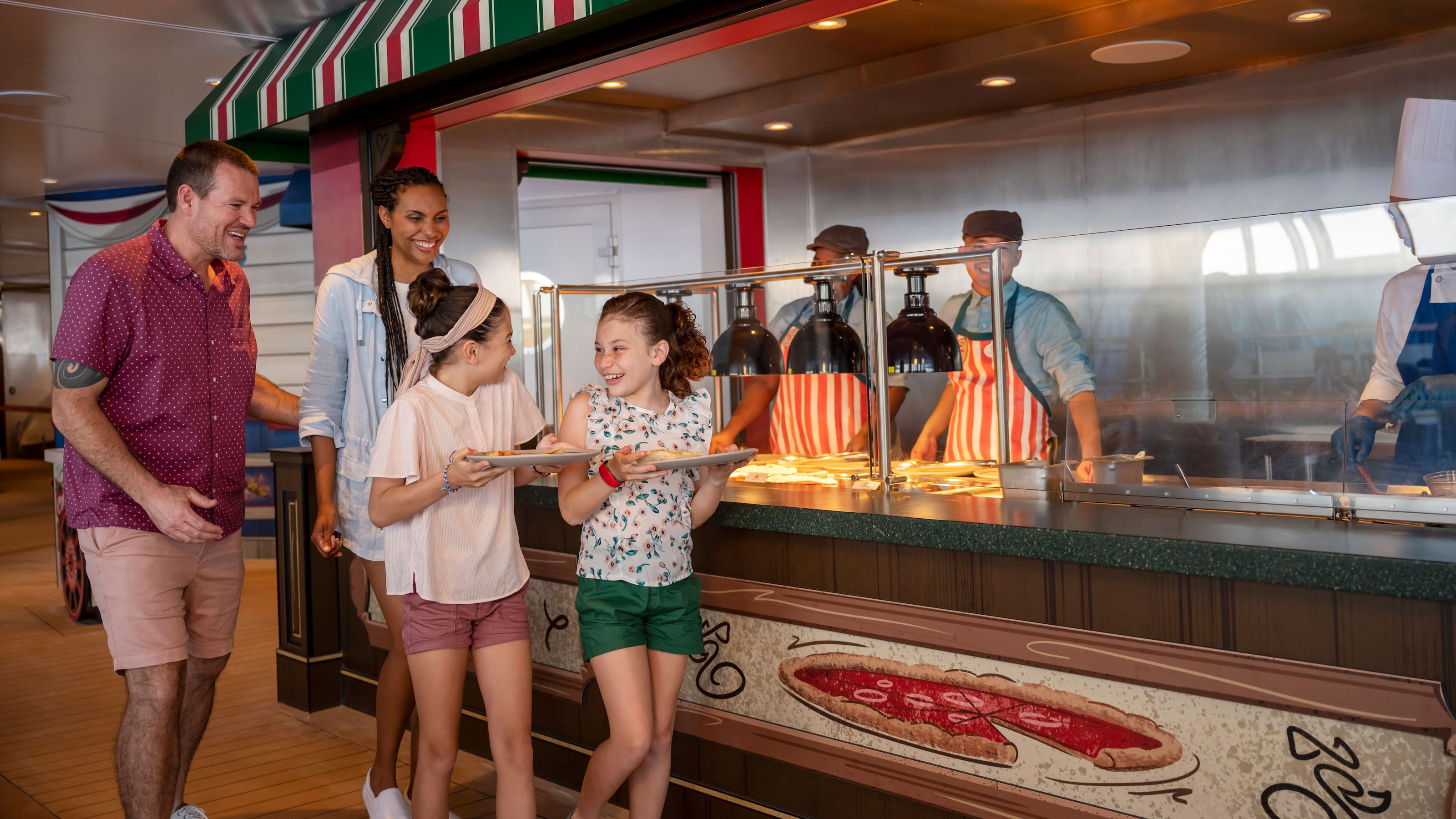 Two girls and 2 adults grab pizza from a food station on board the Disney Destiny ship