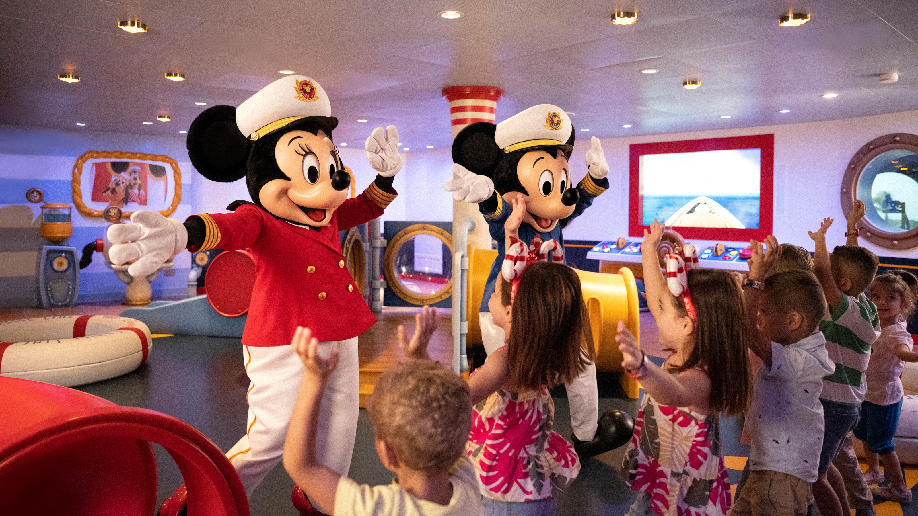 Captains Mickey and Minnie Mouse entertaining children on Mickey & Minnie Captain’s Deck